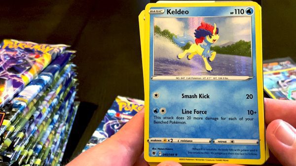 Marriland opening an Astral Radiance pack and looking at a Keldeo card