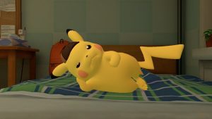 Detective Pikachu on his side on a bed